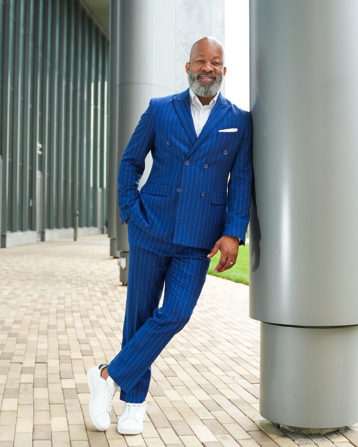 Robert Kennedy III headshot 4: Full length · blue pinstripe