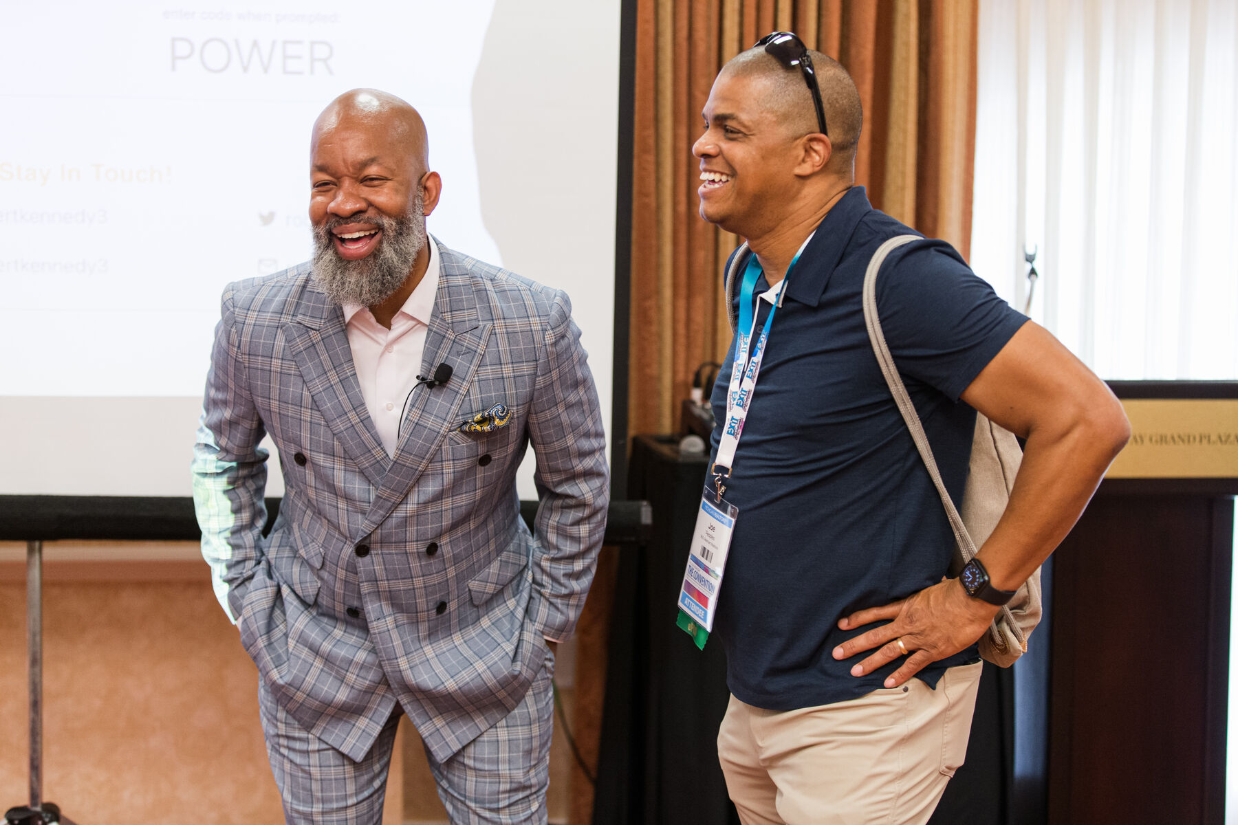 Robert laughing with an attendee